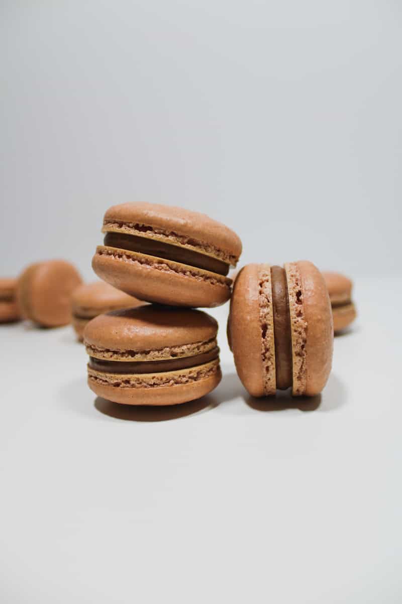 Three Mocha Macarons filled with a mocha swiss meringue buttercream